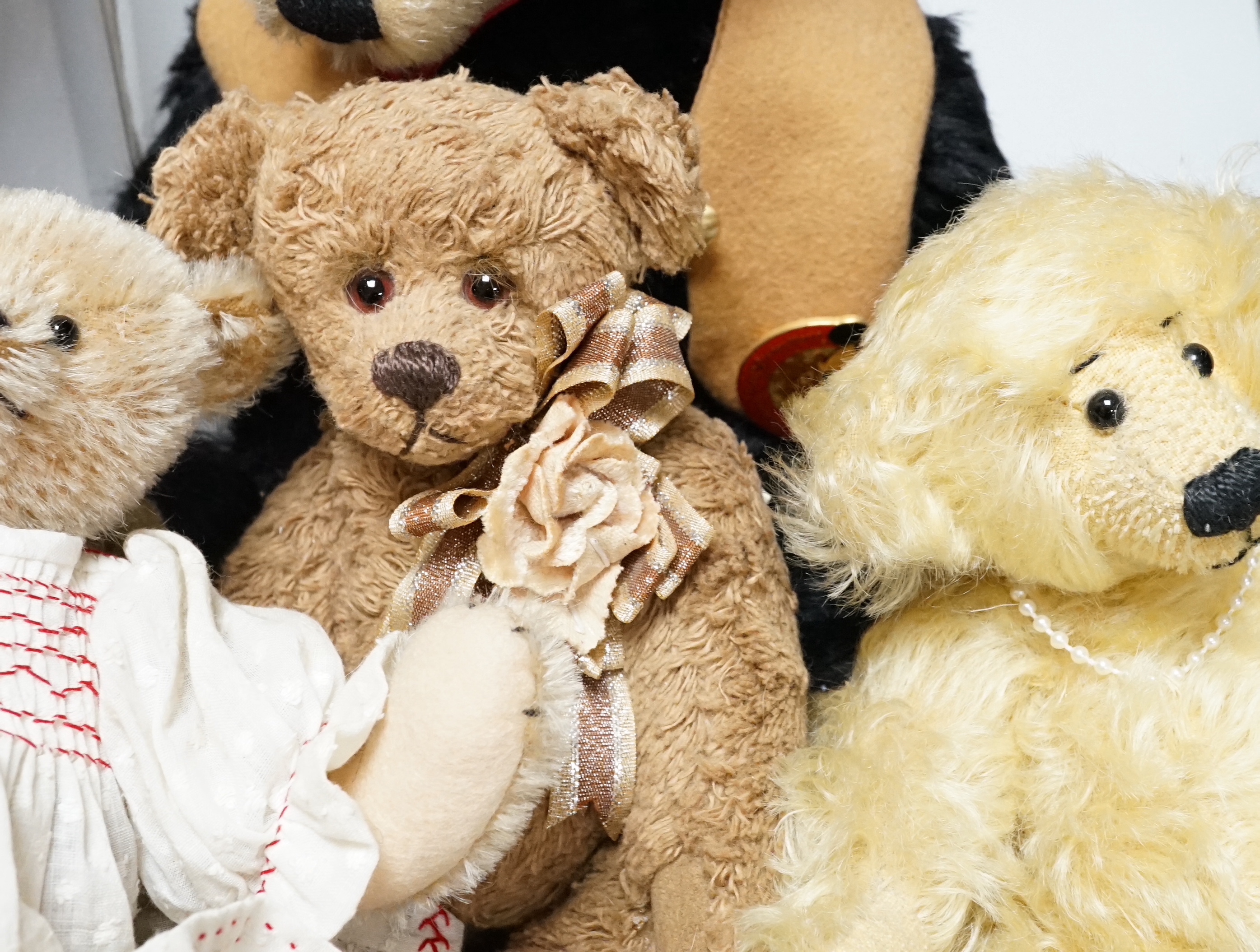 A Merrythought teddy and golly, boxed, with five artist's bears